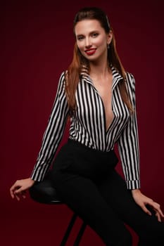 Portrait of a confident woman posing in stylish lingerie, captured in a studio with rich backgrounds and soft lighting.