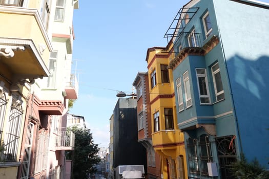 Vibrant houses of different colors create a lively atmosphere outdoors.