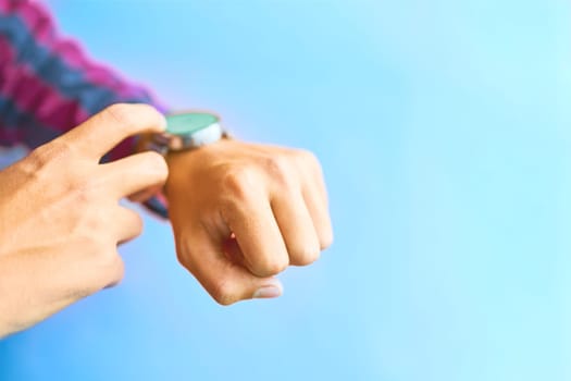 Concept for business, omnichannel, multi payment, lifestyle using and other. Smartwatch - modern digital gadget with empty display, copy space. Blue background