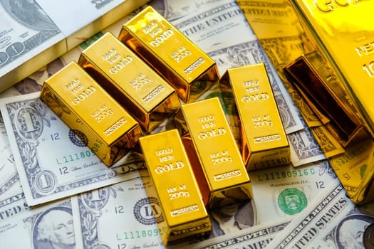 Gold bars and dollar banknotes. Business and finance investment concept.