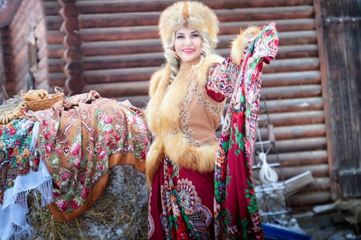 A girl in traditional Russian attire poses with a horse during the Maslenitsa holiday, celebrating cultural heritage.