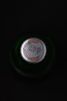 Gaziveren Cyprus -12.03.2025 Beypazari 200 Ml Mineral Water Droplets of condensation shimmer on the green bottle cap, hinting at refreshing moments awaiting in the darkness.
