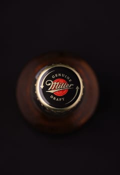 Gaziveren Cyprus -12.03.2025 Beer Miller A close-up of a chilled beverage cap rests against a dark backdrop, capturing the essence of a leisurely evening.