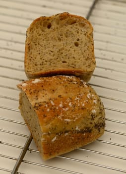 Freshly baked sourdough bread showcases a golden crust and a soft, airy crumb, resting on a cooling rack.