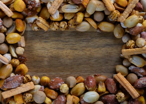 A vibrant mix of assorted snacks fills the frame, adding texture and flavor to a lively gathering atmosphere.