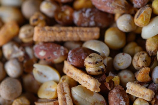 A vibrant mix of nuts and snacks creates an inviting spread perfect for sharing at a cheerful gathering with friends.