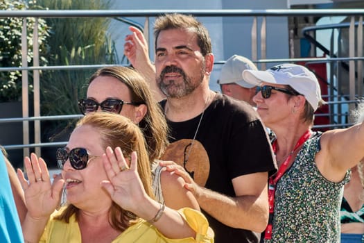 Catania. Italy - March 11, 2025: Joyful participants engaging in a fun outdoor event, showcasing cheerful expressions and dynamic involvement in a recreational setting.