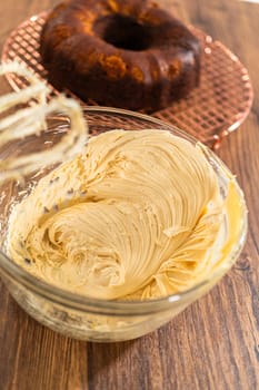 Whipping up salted caramel buttercream frosting for the gingerbread bundt cake.