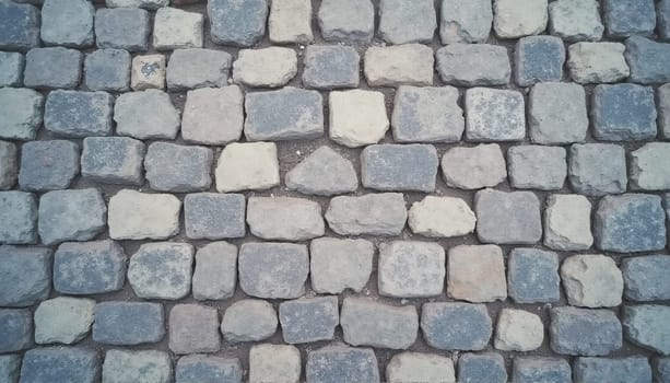 Smooth texture of a gray cobblestone wall or road backdrop. A path or pathway with a repeating surface pattern of tileable, gritty natural rock and stone. A 3D representation of a construction background in high resolution. . High quality photo