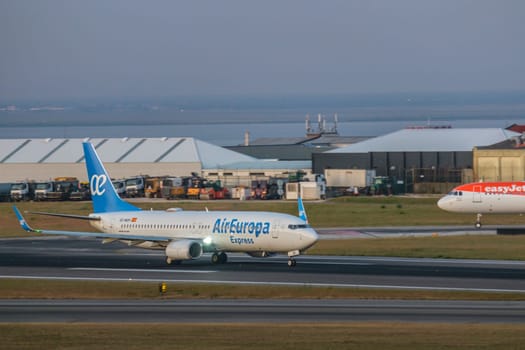 Lisbon, Portugal - Apr 3, 2024: Air Europa Express airline Boeing 737-800 aircraft taxi on runway at Lisbon airport, ready for take off. Vacations, weekend getaway, summer travel destination, international hub, river, takeoff, landing