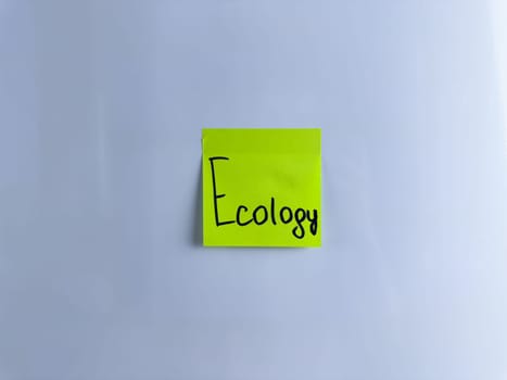 Conceptual photo about ecology with sticky note. The word ecology on white background to draw attention to environmental issues and care for animals and plants, green energy and ecology
