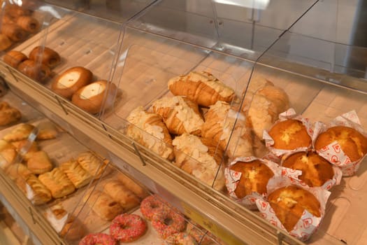 Pies and sweet pastries on display at bakery