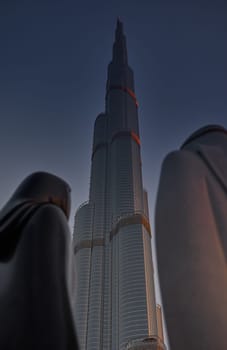 UAE, Dubai, 15 December 2024: The main national monument the sculpture Together made of white Carrara marble, an Arab couple in traditional Emirati clothes, the Syrian sculptor Lutfi Romhain. High quality 4k footage