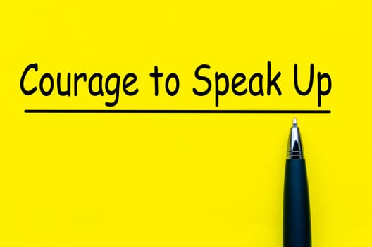 Courage to speak up text on yellow notepad. Speak up culture.