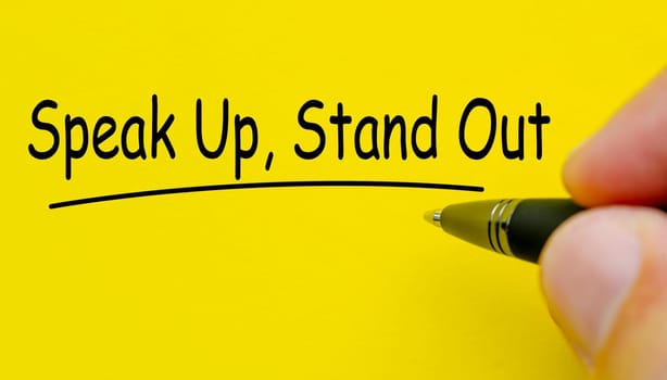 Speak up and stand out text on yellow cover background