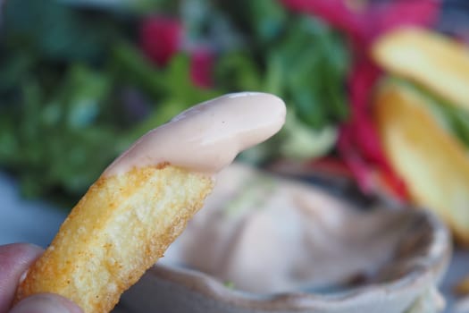 chips dipped in creamy sauce,