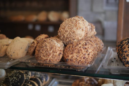 Assorted delicious cookies are showcased in a warm bakery setting.