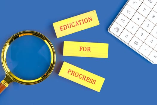 Materials emphasize the importance of education for advancement, accompanied by a magnifying glass and calculator.