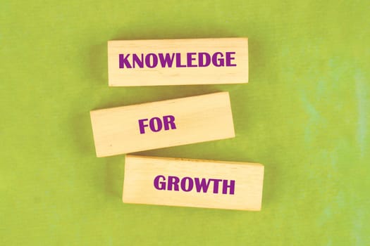 Blocks display the phrase presenting knowledge as essential for individual and societal growth in education and development contexts.