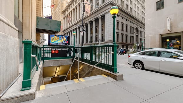 Wall Street, Manhattan, New York, USA - February 12, 2023: Wall Street Station subway entrance in the business district on a winter day