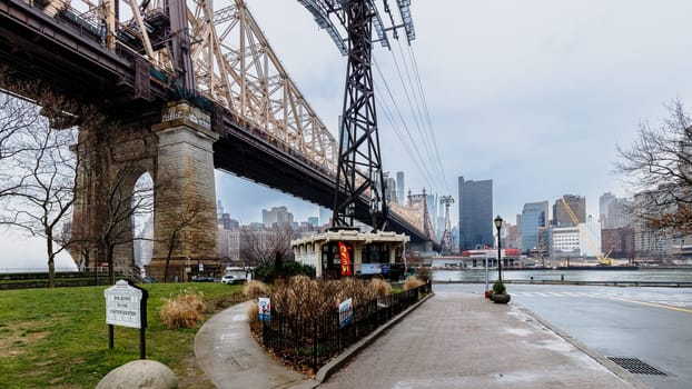 Manhattan, New York, USA - February 16, 2024: Ed Koch Queensboro Bridge and surroundings on a gray winter day