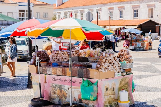 Nazare, Portugal - May 28, 2024: The central square of Nazare Sitio on the hill with its tourists and street vendors on a beautiful spring day