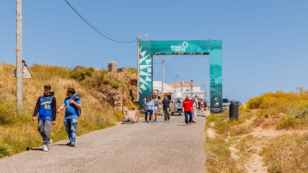 Nazare, Portugal - May 28, 2024: arch welcoming the biggest waves in the world to the hill on a beautiful spring day