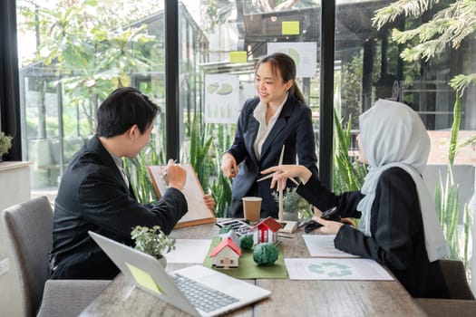 A collaborative environment where team members brainstorm sustainable strategies and eco-design approaches to enhance living spaces.