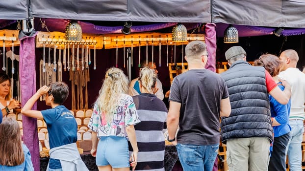 Braga, Portugal - May 26, 2024: Street vendors selling handicrafts in the historic city center during the Braga Romana event on a spring day