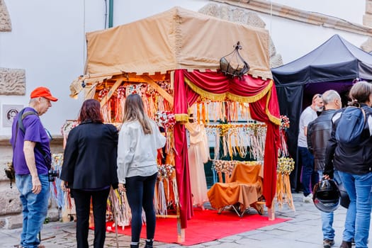Braga, Portugal - May 26, 2024: Street vendors selling handicrafts in the historic city center during the Braga Romana event on a spring day