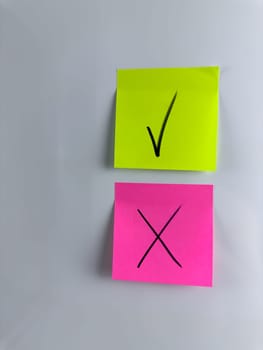 Conceptual vertical photo about choosing answer and making decision. Answering question and marking choice with tick or cross to indicate the answer. Choose solution and mark with symbol