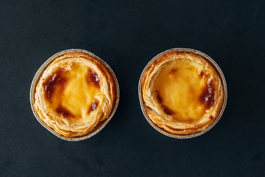 Classic Portuguese Pastel de Nata on Black Slate.