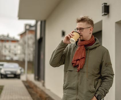 Young Attractive Man On The Street Relaxing Outdoors During A Break