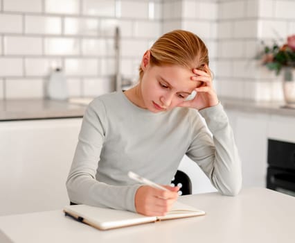 Cute Little Girl Doing Homework And Solving The Problem