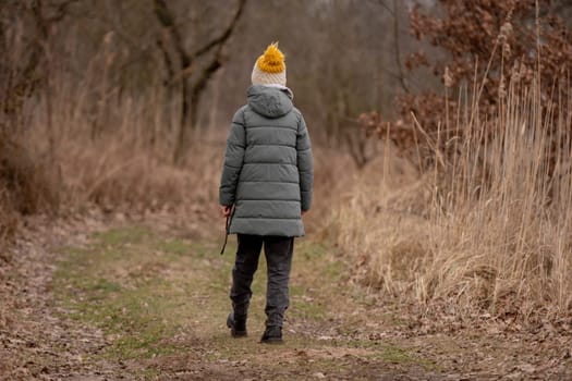 Girl In The Forest In Early Spring Viewed From Behind