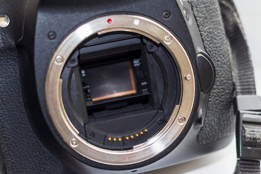 Close up shot of partially damaged opened camera body