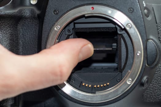 Close up shot of partially damaged opened camera body