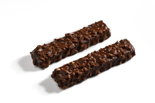 Two delicious chocolate bars featuring a crunchy texture, ideal for satisfying sweet cravings during the afternoon.