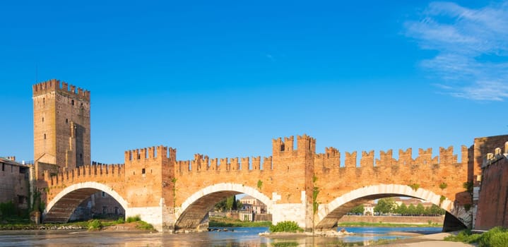 Verona, Italy. Castelvecchio bridge on Adige river. Old castle sightseeing at sunrise