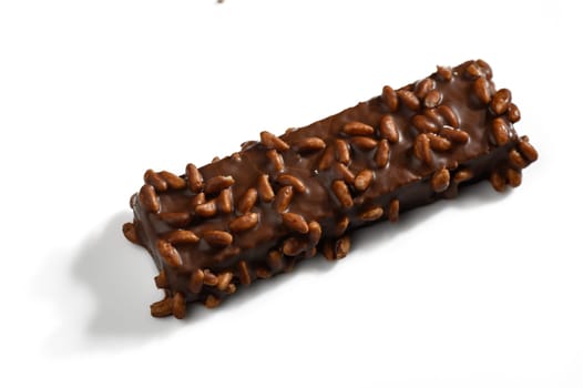 Rich chocolate envelops a delectable bar sprinkled with crispy rice, inviting a sweet indulgence.