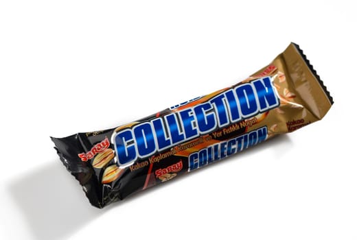 Gaziveren Cyprus -15.02.2025 Chocolate delight wrapped with shiny packaging offers a tempting snack experience in a minimalist space