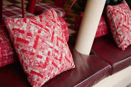 Comfortable red cushions enhance the inviting atmosphere of this space.