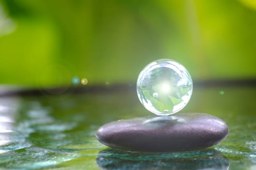 Shining glass marble representing peace and harmony with customizable space for text of message. Peace concept.
