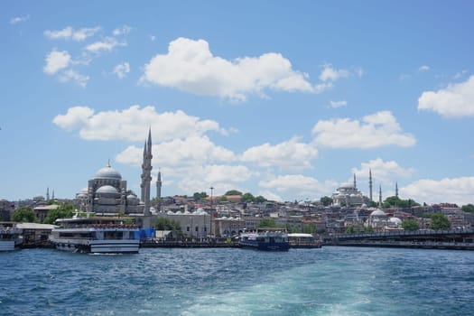 Beautiful skyline of Istanbul featuring mosques and boats on the water.