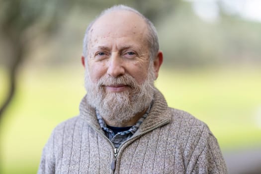 Cheerful retired professor enjoys retirement in a peaceful university garden setting