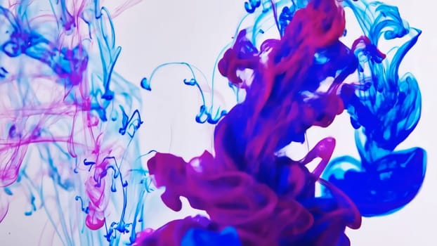 Vibrant colors of flowing ink and liquid paint mix together, forming a captivating abstract background. The fluid movement of colors creates an enchanting texture that draws the viewer in.
