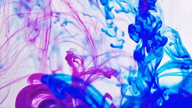 Colors intertwine as flowing ink and liquid paint merge, forming an energizing backdrop. The fluid motions create an abstract display, highlighting the beauty of movement and contrast.
