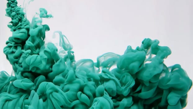 Vivid colors blend together as flowing ink and liquid paint transform into an abstract backdrop. The continuous dripping conveys a sense of movement and creativity.
