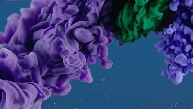 A beautiful array of flowing ink creates mesmerizing patterns in a liquid paint backdrop.