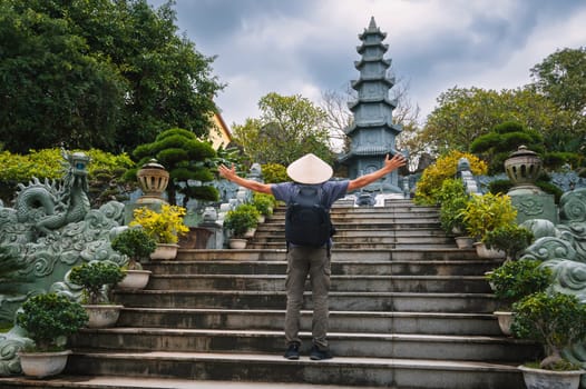man tourist traveler at the Linh Ung Pagoda in Da Nang in Vietnam. The concept of travel and tourism in Asia